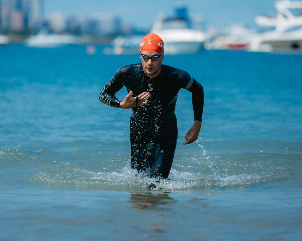 Athlete exiting the water during a triathlon swim